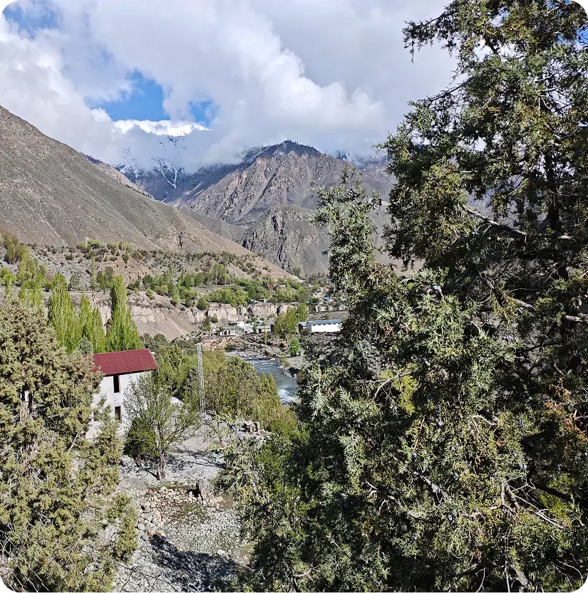 Mountain landscape with a riverside home in Astore Valley